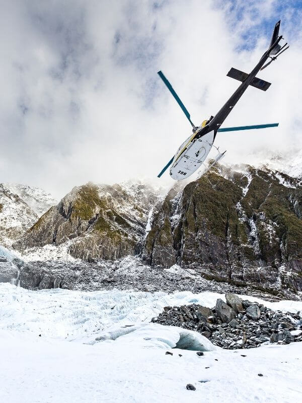 helicopter flying above Franz Josef glacier