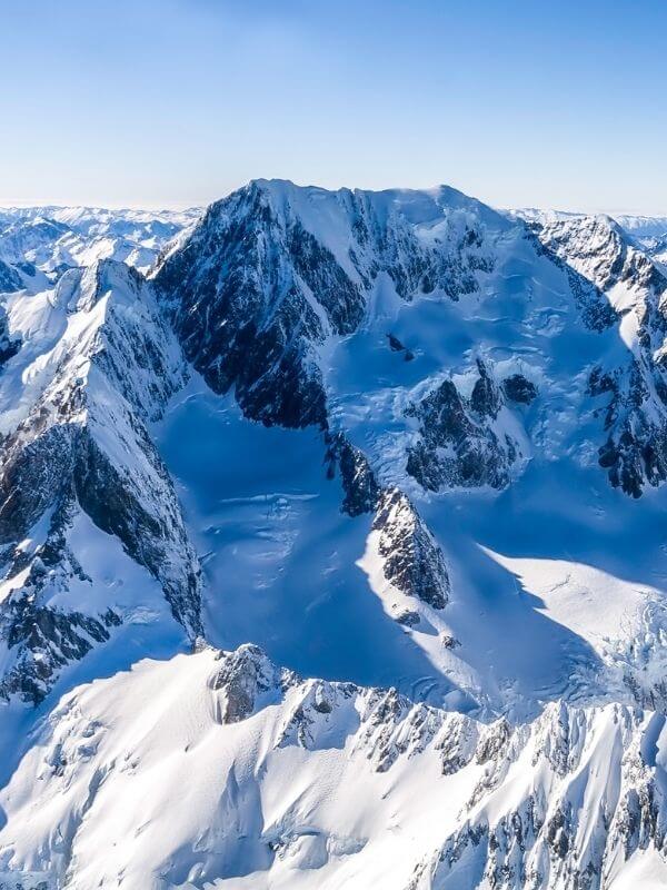 Views from helicopter of snow on mountains