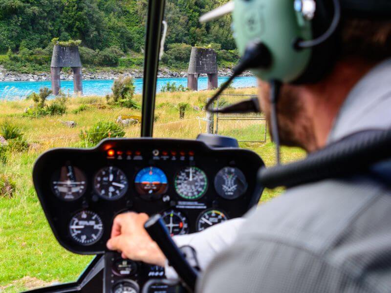 Cockpit of helicopter flying over snow